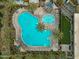 Aerial view of resort-style community pool with lounge chairs and landscaping at 9960 E Revolution Dr, Mesa, AZ 85212