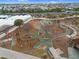 Aerial view of community park and playground with play equipment and open space at 9960 E Revolution Dr, Mesa, AZ 85212