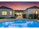 Inviting backyard featuring a sparkling pool and beautiful patio pavers at 9960 E Revolution Dr, Mesa, AZ 85212