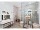 Elegant bathroom with a spacious walk-in shower, modern vanity, and stylish decor at 9960 E Revolution Dr, Mesa, AZ 85212