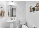 Modern bathroom with pedestal sink and decorative wall art at 9960 E Revolution Dr, Mesa, AZ 85212
