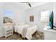 Bright bedroom with cozy bed, stylish rug, and abundant natural light at 9960 E Revolution Dr, Mesa, AZ 85212