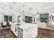 Gourmet kitchen island offering ample counter space, stainless steel appliances, and modern lighting at 9960 E Revolution Dr, Mesa, AZ 85212