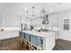 Modern kitchen with an island, seating, and sleek cabinetry at 9960 E Revolution Dr, Mesa, AZ 85212