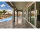 An exterior view of the outdoor living space, complete with a covered patio and a refreshing pool at 11203 N Northfield St, Surprise, AZ 85388