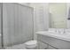 Bright bathroom features a modern vanity, patterned shower curtain and a sleek towel rack at 11203 N Northfield St, Surprise, AZ 85388