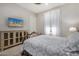 This bedroom has a decorative bed frame, tv, side tables, and overhead fan at 11203 N Northfield St, Surprise, AZ 85388