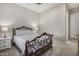 Bedroom features a decorative bed frame, side tables, and overhead fan at 11203 N Northfield St, Surprise, AZ 85388