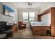 This bedroom is a versatile flex space with a pull-down Murphy bed and wood-look tile at 11203 N Northfield St, Surprise, AZ 85388