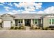 Charming single-story home featuring a well-manicured front yard and inviting covered porch at 11203 N Northfield St, Surprise, AZ 85388