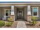 Inviting front porch with stone accents and a brick walkway leading to the entrance at 11203 N Northfield St, Surprise, AZ 85388