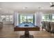 Spacious game room featuring a pool table with an open view to the kitchen at 11203 N Northfield St, Surprise, AZ 85388