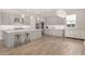 Bright kitchen featuring a large island with counter seating and stainless steel appliances at 11203 N Northfield St, Surprise, AZ 85388