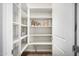 Walk-in pantry features built-in shelving and storage at 11203 N Northfield St, Surprise, AZ 85388