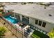 Aerial view of pool and patio with outdoor seating and a built-in barbeque grill at 11203 N Northfield St, Surprise, AZ 85388