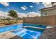 A backyard oasis showcases a sparkling pool, spa, and beautifully tiled deck for outdoor enjoyment at 11203 N Northfield St, Surprise, AZ 85388