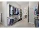Spacious walk-in closet with custom shelving and racks at 11203 N Northfield St, Surprise, AZ 85388