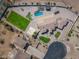 Expansive estate featuring a large pool, basketball court, putting green, and lush green lawns at 11225 E Starflower Ct, Chandler, AZ 85249