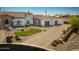Beautiful aerial view of the white home and its three-car garage and circular driveway at 11225 E Starflower Ct, Chandler, AZ 85249