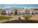 Stunning aerial view of the home's beautiful landscaping, circular driveway, and well-maintained exterior at 11225 E Starflower Ct, Chandler, AZ 85249