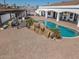 The backyard offers a private pool with rocky features, perfect for relaxation and outdoor fun at 11225 E Starflower Ct, Chandler, AZ 85249