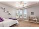 A well-appointed bedroom featuring unique arched windows and stylish decor at 11225 E Starflower Ct, Chandler, AZ 85249
