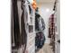 Well-organized walk-in closet with hanging rods and shelving, perfect for storage at 11225 E Starflower Ct, Chandler, AZ 85249