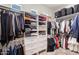 Spacious walk-in closet with custom shelving and ample storage for clothes and accessories at 11225 E Starflower Ct, Chandler, AZ 85249