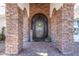 A welcoming front entrance with a decorative door and stone accents at 11225 E Starflower Ct, Chandler, AZ 85249
