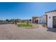 Well-manicured front yard with lush green lawn and brick paver walkway at 11225 E Starflower Ct, Chandler, AZ 85249