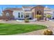 A beautifully landscaped front yard with lush greenery and desert plants at 11225 E Starflower Ct, Chandler, AZ 85249