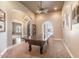 Entertain in this game room with pool table, shuttered window, and designer color palette at 11225 E Starflower Ct, Chandler, AZ 85249