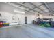 Spacious three-car garage with ample room for vehicles and storage at 11225 E Starflower Ct, Chandler, AZ 85249