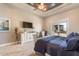 Retreat to the main bedroom with a ceiling fan and backyard access at 11225 E Starflower Ct, Chandler, AZ 85249