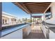 Fully equipped outdoor kitchen with stainless steel appliances and ample counter space under a pergola at 11225 E Starflower Ct, Chandler, AZ 85249