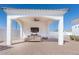 Covered outdoor patio with a comfortable seating area and a ceiling fan at 11225 E Starflower Ct, Chandler, AZ 85249