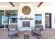 Outdoor patio area showcasing comfortable seating and a decorative fireplace at 11225 E Starflower Ct, Chandler, AZ 85249