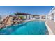 Enjoy a luxurious backyard pool with a slide and waterfall feature at 11225 E Starflower Ct, Chandler, AZ 85249