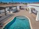 Outdoor living featuring a pool, BBQ, bar, and covered seating area; perfect for entertaining guests at 11225 E Starflower Ct, Chandler, AZ 85249