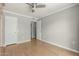 Spacious bedroom with wood floors, neutral walls, and ample closet space at 13226 N Cedar Dr, Sun City, AZ 85351