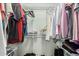 Organized walk-in closet with metal shelving and hanging racks, offering ample storage space at 13226 N Cedar Dr, Sun City, AZ 85351