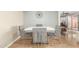 Dining room with a modern table, plush velvet chairs, and stylish decor at 13226 N Cedar Dr, Sun City, AZ 85351