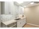 Bright kitchen features white cabinets, stainless steel appliances, and hardwood floors at 13226 N Cedar Dr, Sun City, AZ 85351