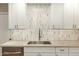 Bright kitchen features white cabinets, stainless steel appliances, and countertop at 13226 N Cedar Dr, Sun City, AZ 85351