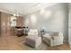 Spacious living room with an adjacent bar and a cozy seating arrangement at 13226 N Cedar Dr, Sun City, AZ 85351