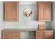 Built-in office nook featuring custom cabinets, granite counters, and plenty of storage at 13226 N Cedar Dr, Sun City, AZ 85351