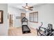Home exercise room featuring a treadmill, elliptical, and natural light at 14302 W Laurel Ln, Surprise, AZ 85379
