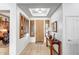 Bright foyer features light floors, shuttered windows, and decorative ceiling detail at 14302 W Laurel Ln, Surprise, AZ 85379
