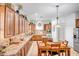 Spacious eat-in kitchen with granite countertops, island, and stainless-steel appliances at 14302 W Laurel Ln, Surprise, AZ 85379