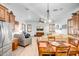 Open-concept living area connects to kitchen, features white walls, and ample natural light at 14302 W Laurel Ln, Surprise, AZ 85379